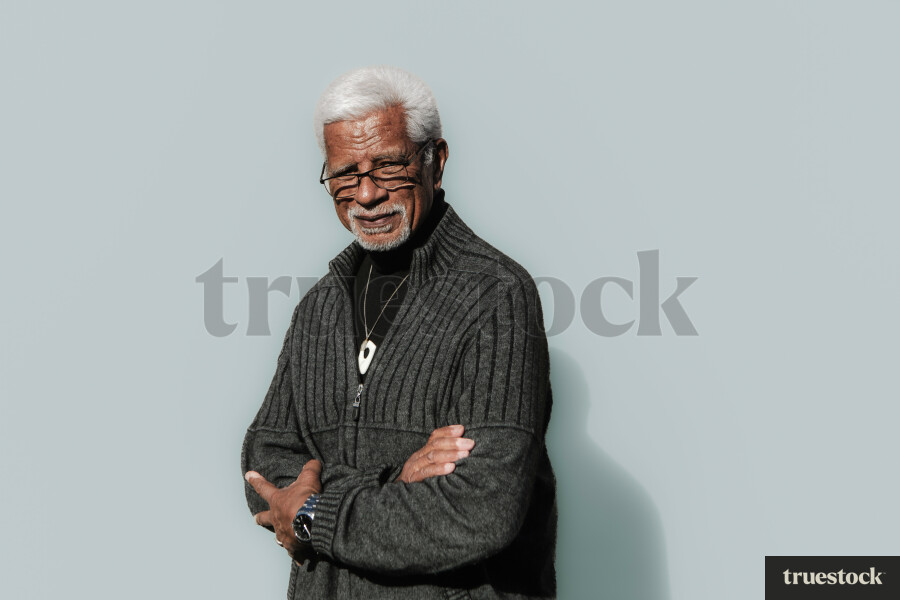 Elderly Māori Man against a Plain Background