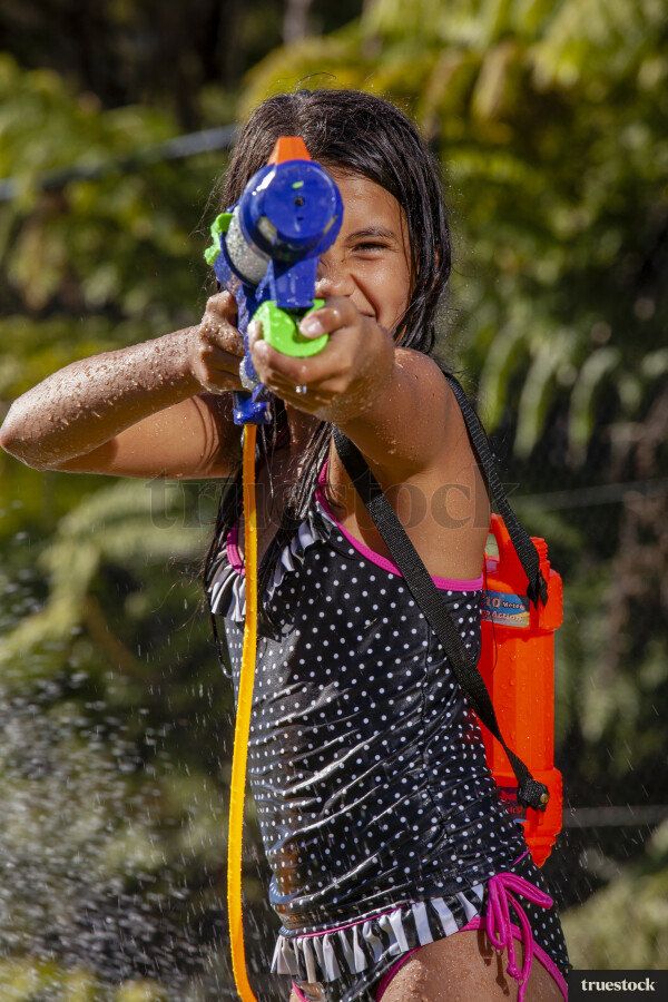Children playing with water pistol