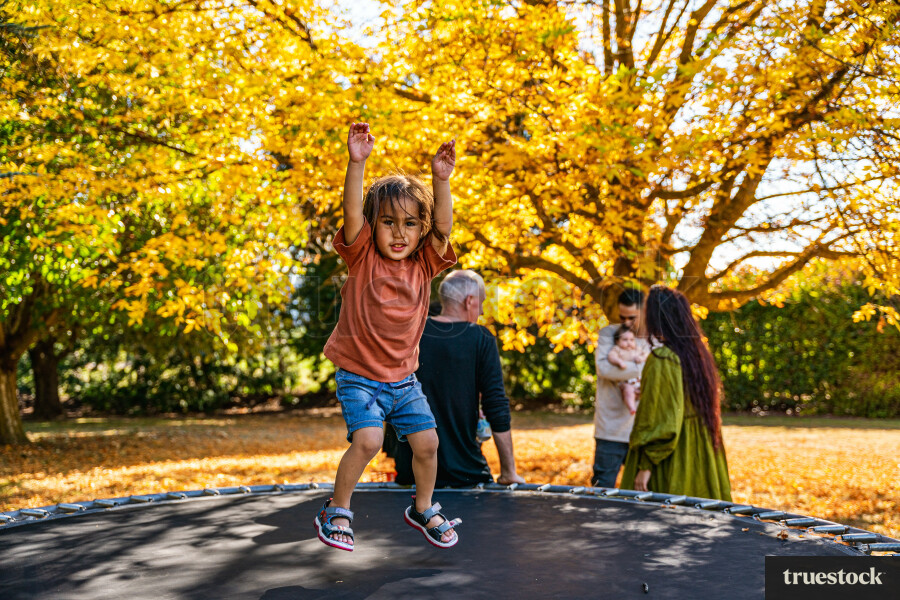 Child Playing on Trampoline