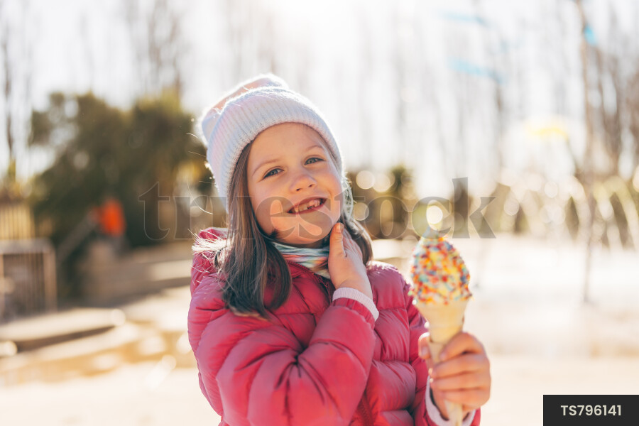 Smiling girl with ice cream cone