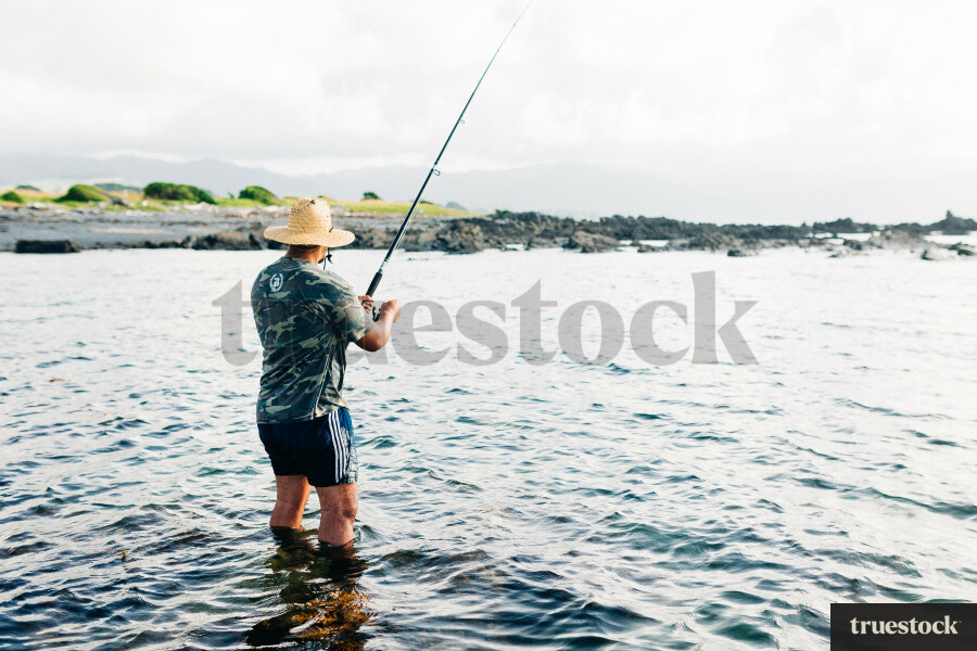 Man Surfcasting Fishing