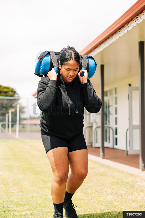 Teen Girls Exercising on Grass
