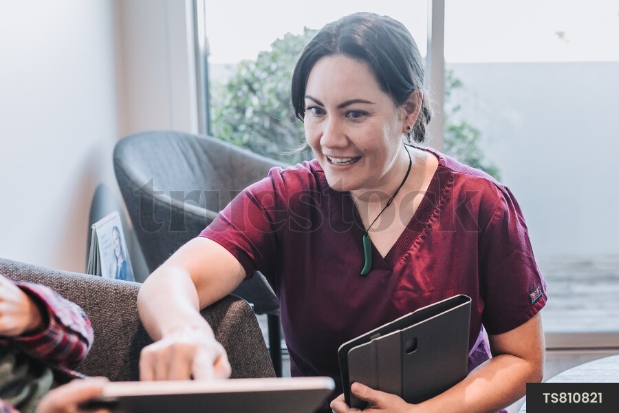 Dentist talking to patient in dental clinic