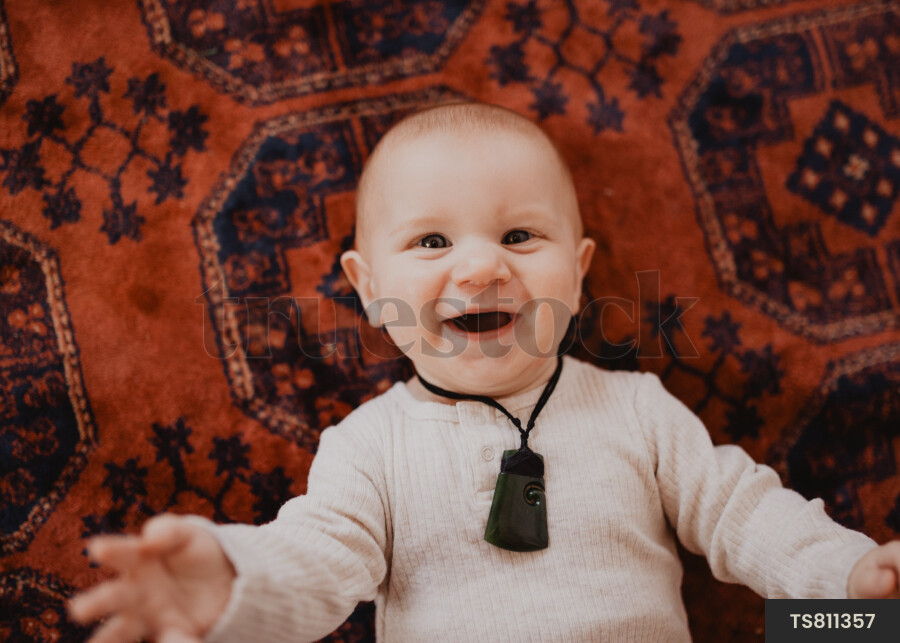 Baby boy with pounamu necklace