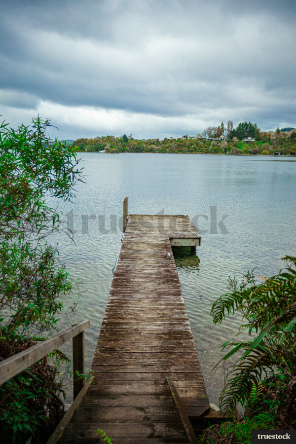 Jetty extending out into the lake on an overcast day
