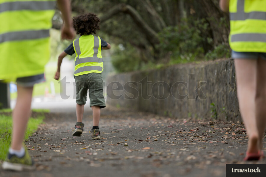 Kids walking along footpath