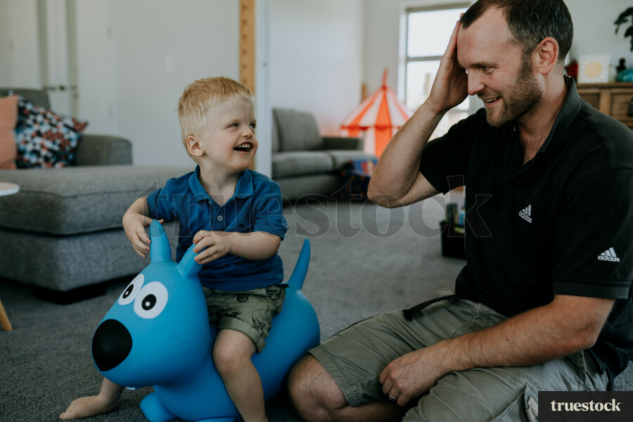 Father doing sign language to toddler