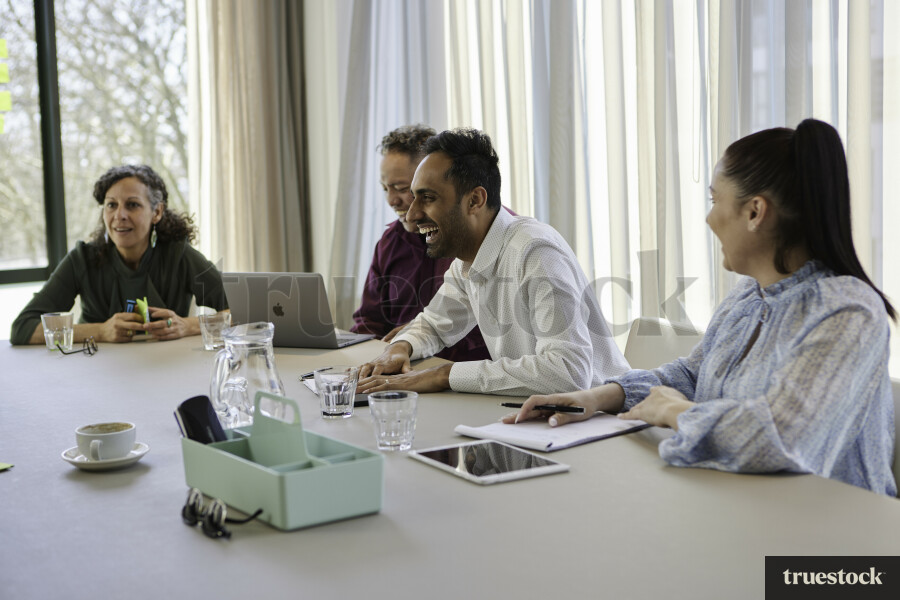 Colleagues Laughing in Meeting