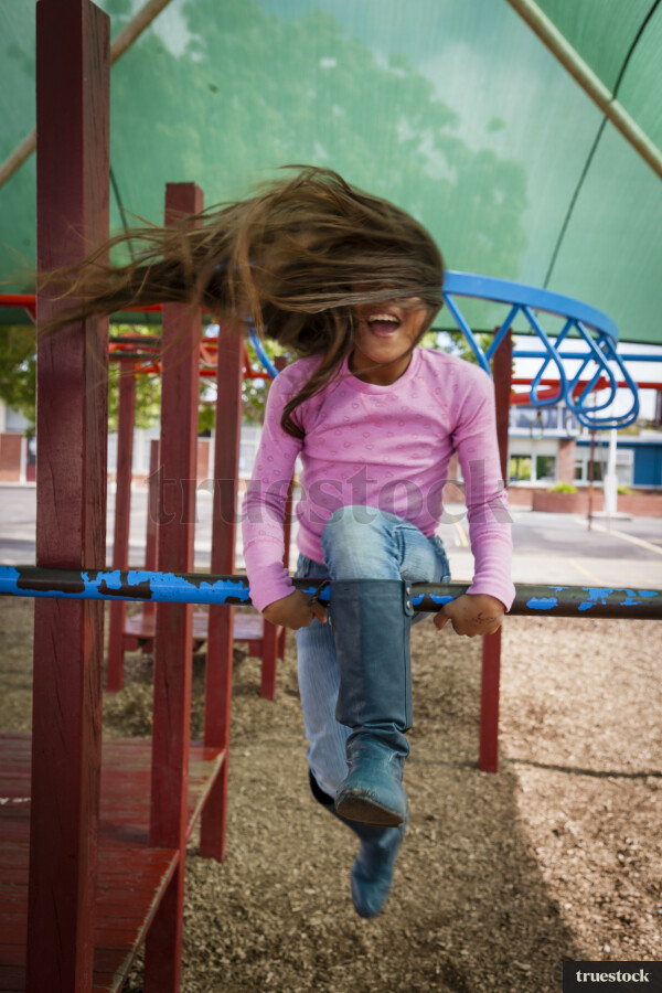 Young Girl Playing on Playground