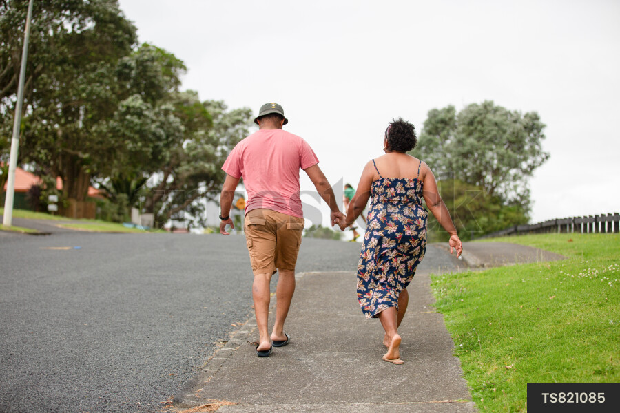 Couple walking on footpath