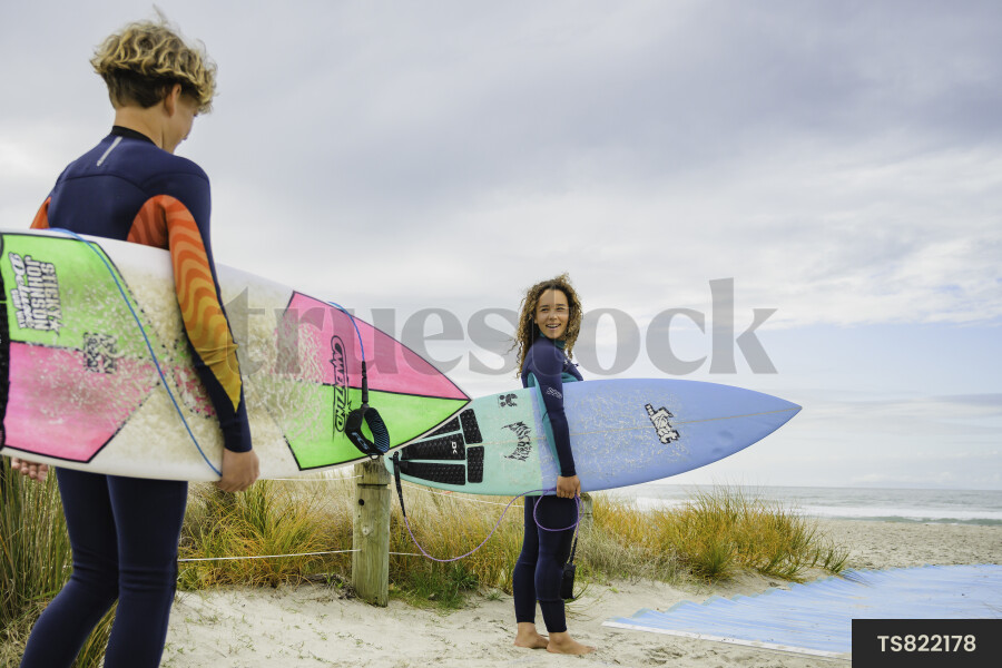 Teen Surfers at Beach