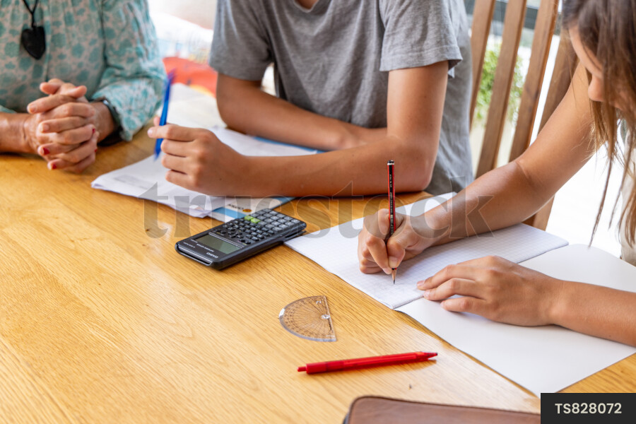 Teens Doing School Work at Home