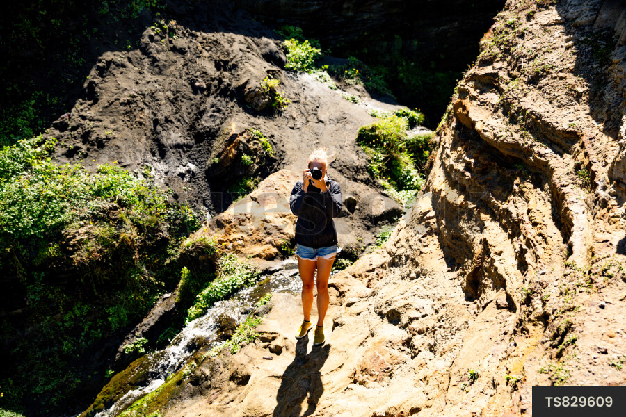 Photographer on rocks
