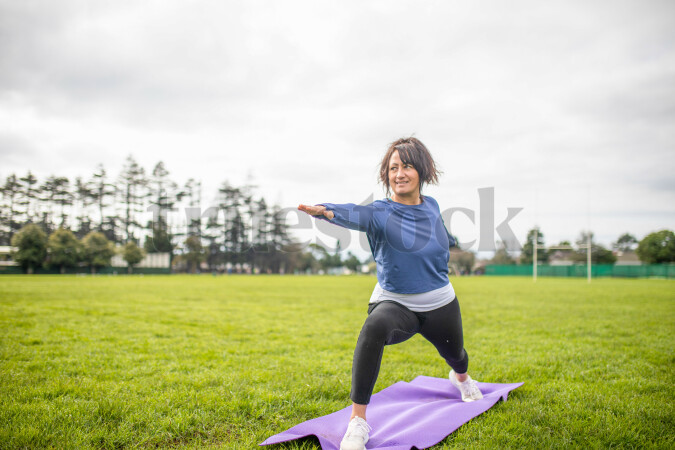 Woman doing Yoga in Park