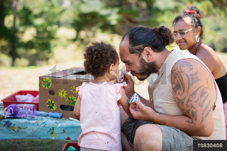Happy family doing arts and crafts in garden