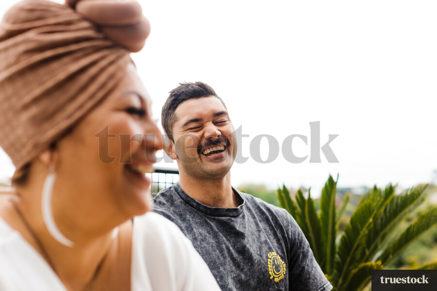 Friends Laughing at Dinner