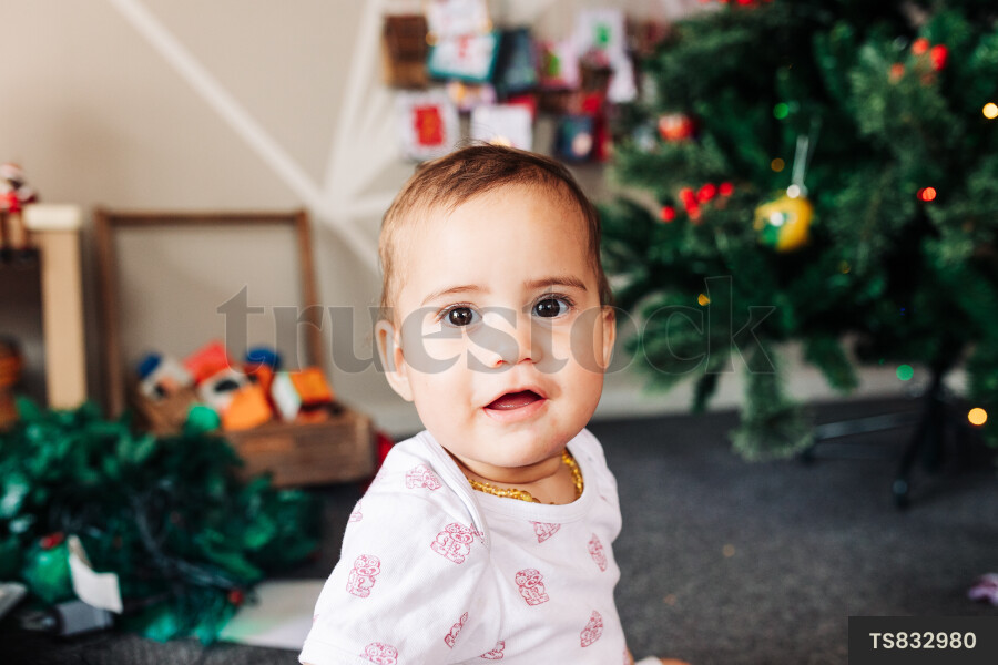 Young Girl By Christmas Tree