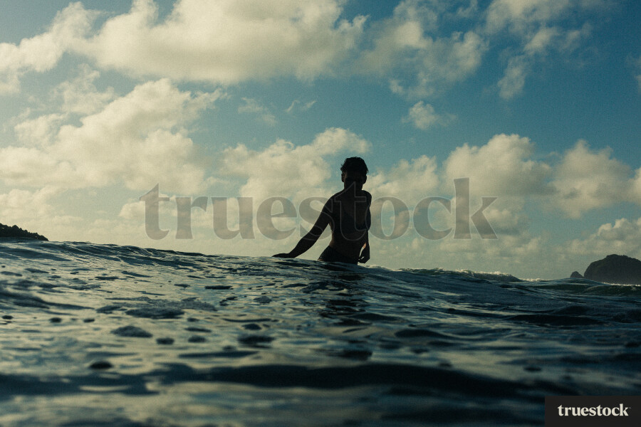 Woman Swimming at Piha Beach