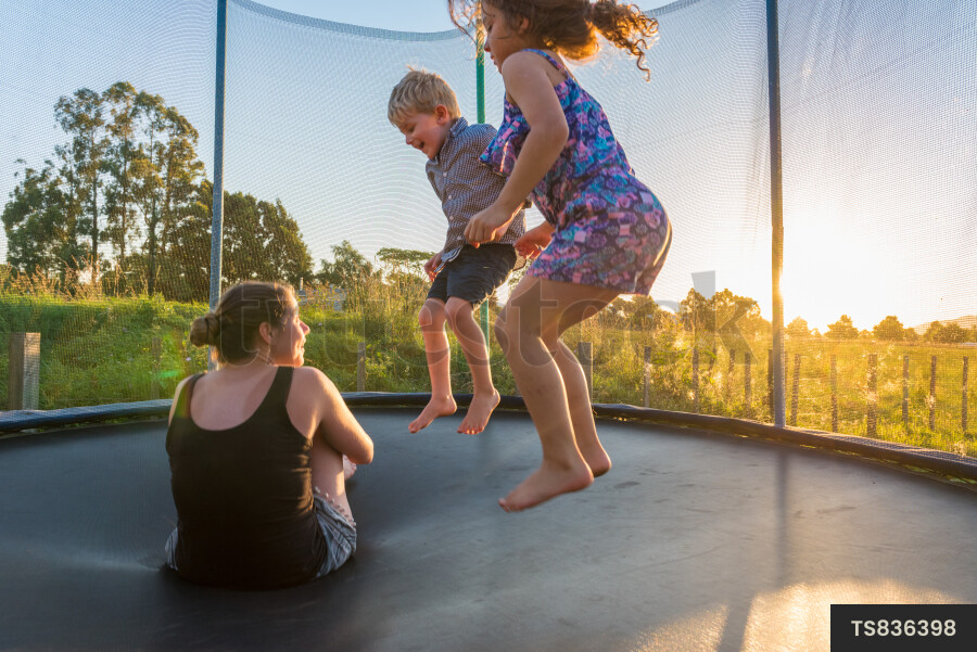 Mother and Kids on Trampoline
