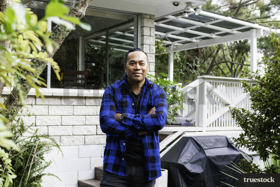 Samoan Man standing outside his Home