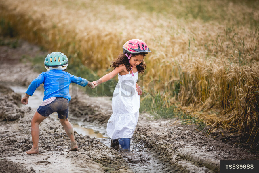 Brother and Sister Playing on Farm