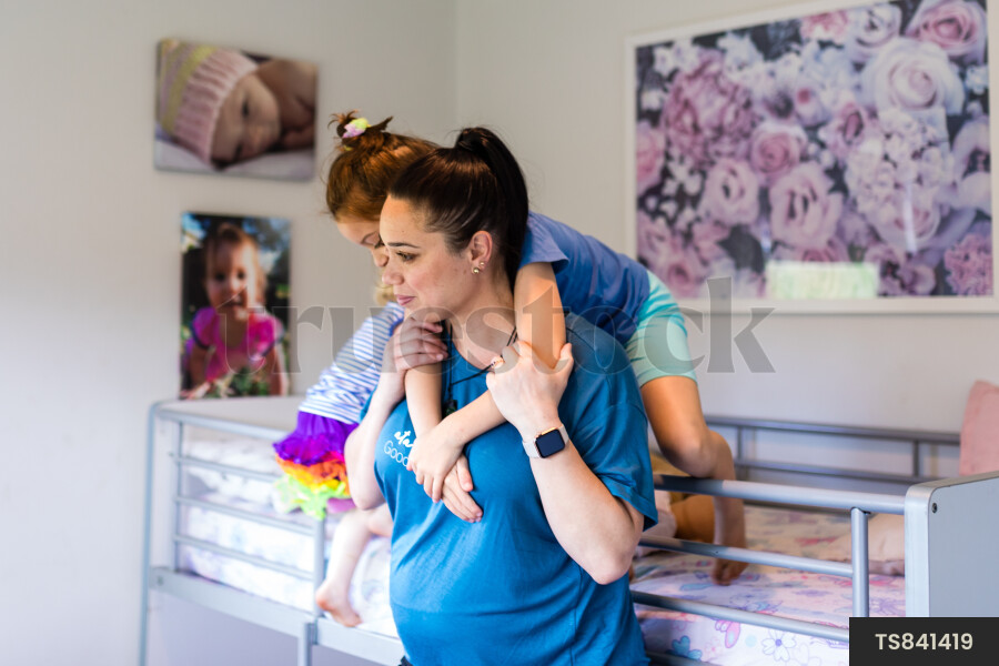 Mother Giving Daughter Piggyback