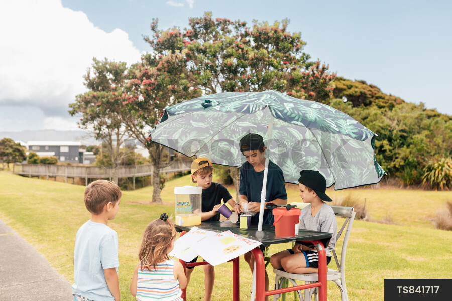 Kids Buying Lemonade at Lemonade Stand