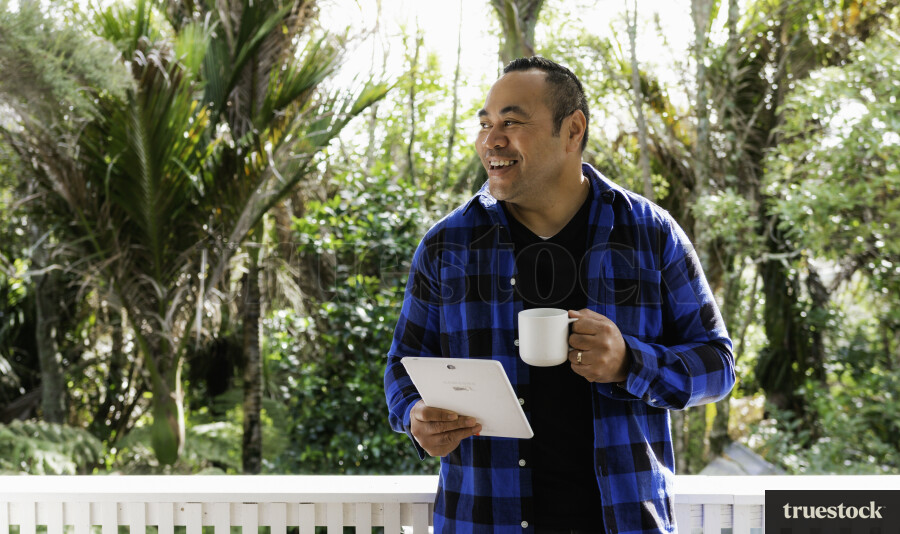 Samoan Man on Device with a Coffee