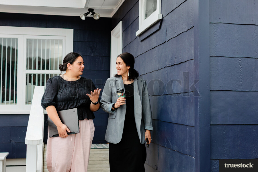 Colleagues Talking While Walking