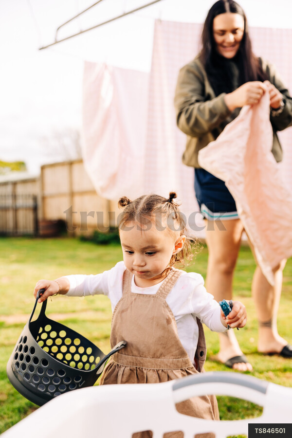 Young Girl Helping with Laundry