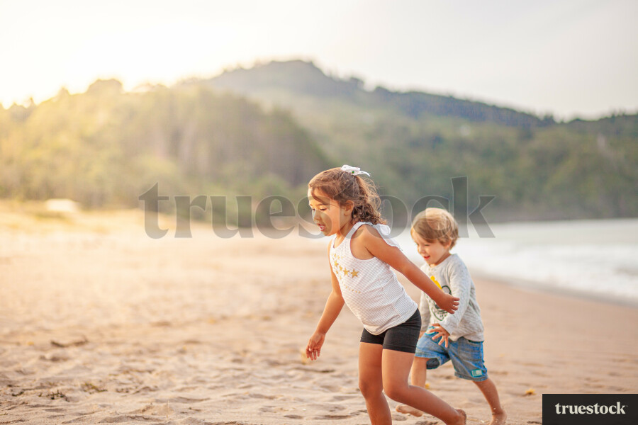 Children running on the beach