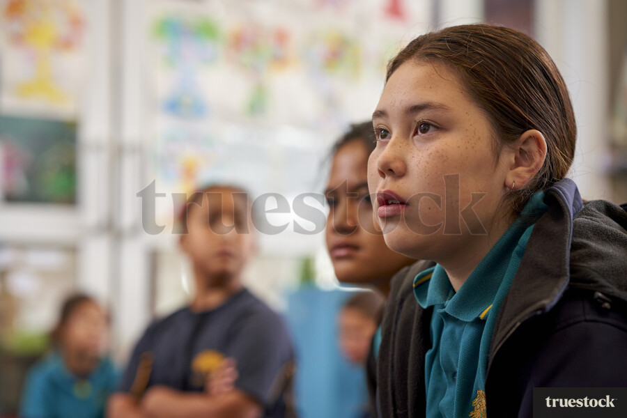 Young Girl Listening in Class