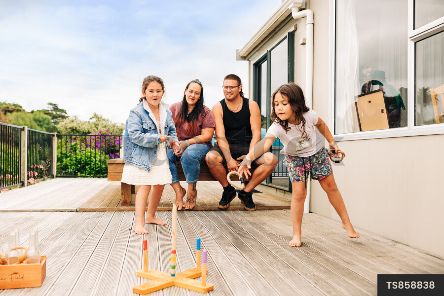 Family playing on deck