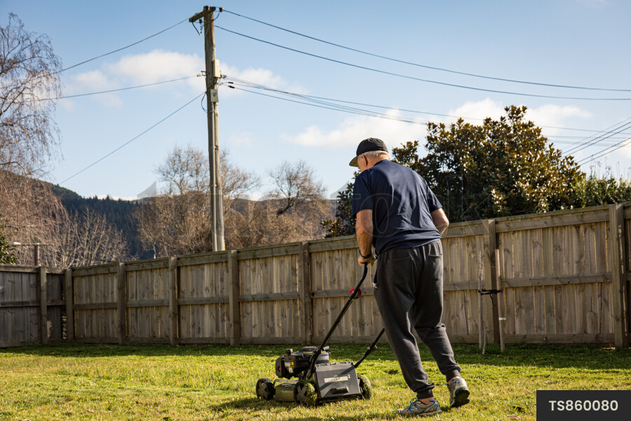 Man Mowing Lawn