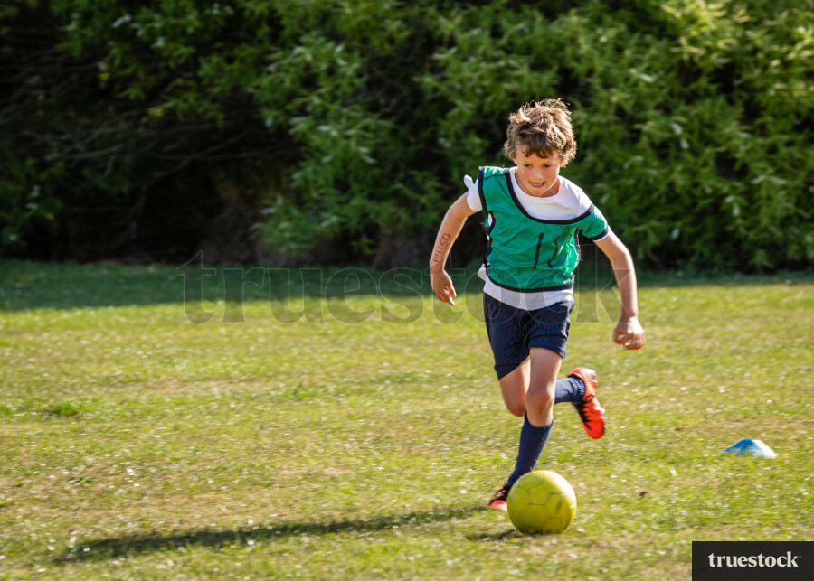 Boy playing soccer