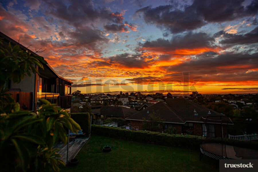 Orange and pink sunset in a suburban area