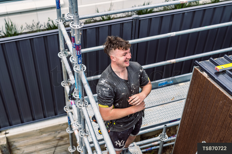 Builder Standing on Scaffolding