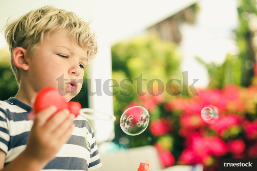 Boy Blowing Bubbles