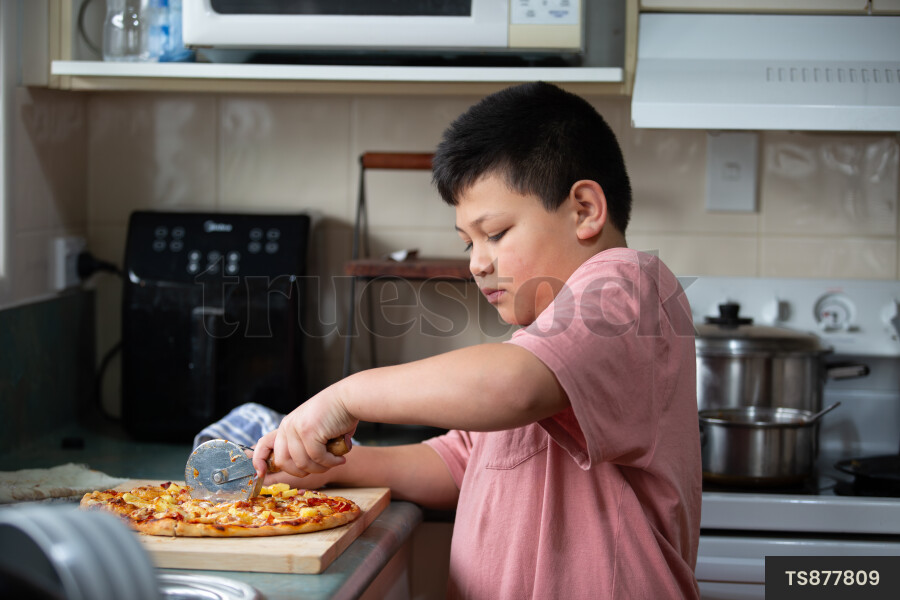 Young Boy with Homemade Pizza