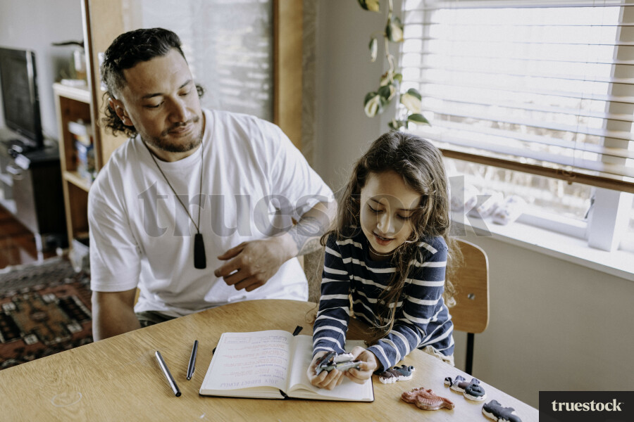 Father Helping Son with Homework