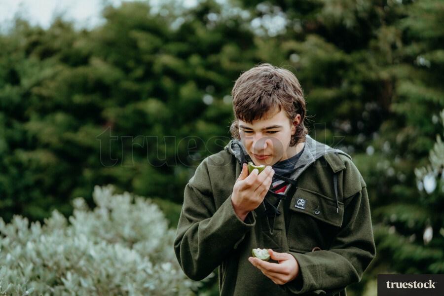 Man eating a feijoa