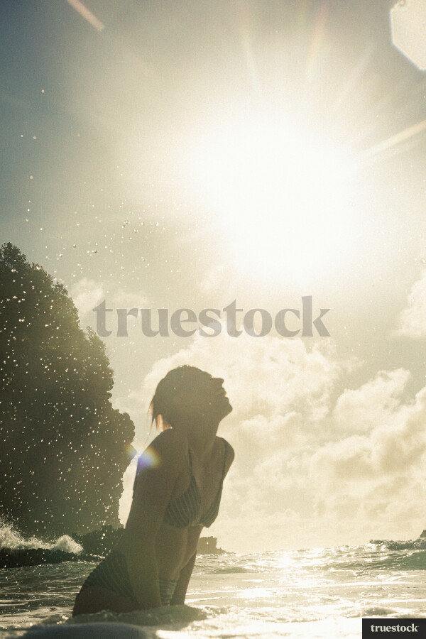 Woman Swimming at Piha Beach