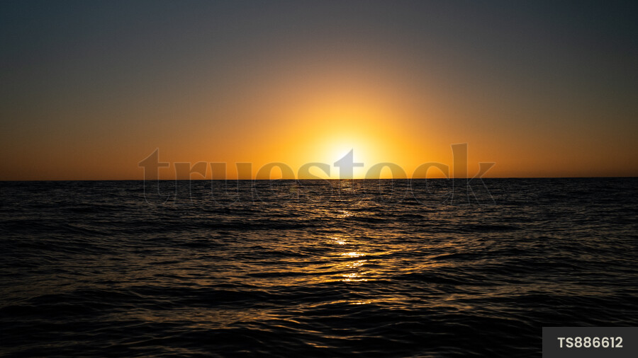 Sunset over sea in Haast