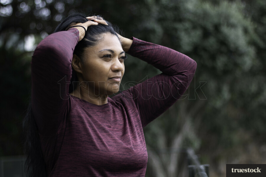 Māori Woman Tying Hair Up