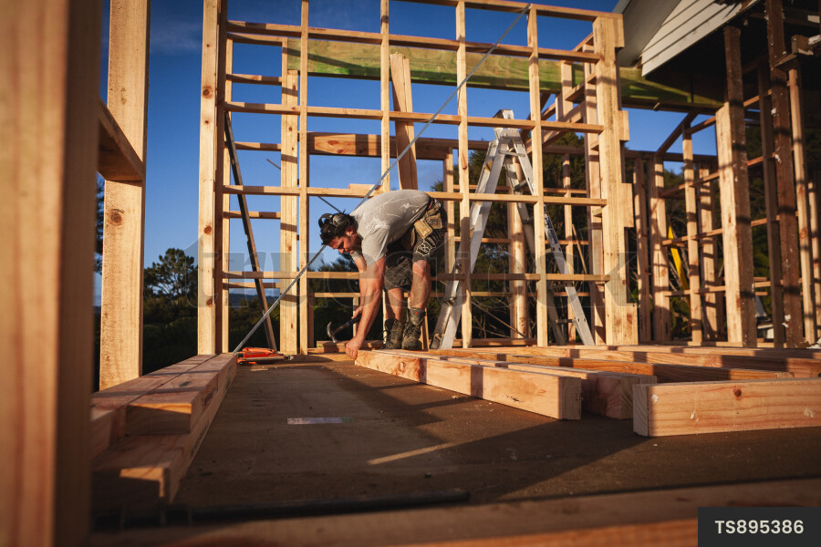 Worker Using Hammer