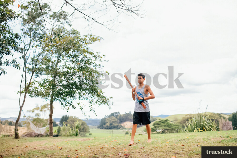 Teenager doing Taiaha in his Backyard