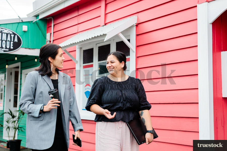 Colleagues Talking While Walking