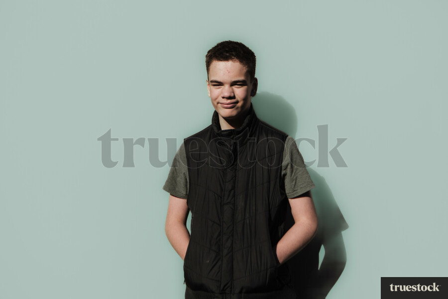 Māori Boy against a Plain Background