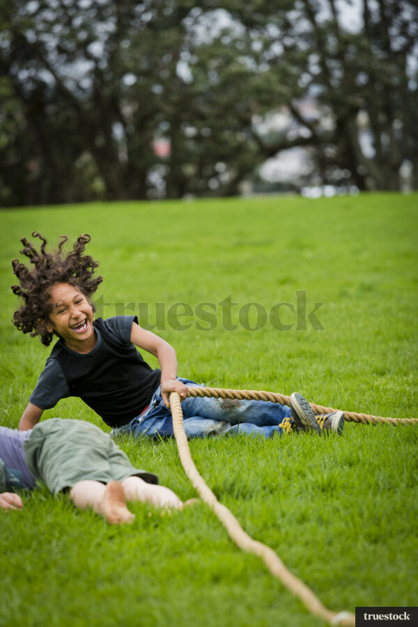 Young boy playing on grass