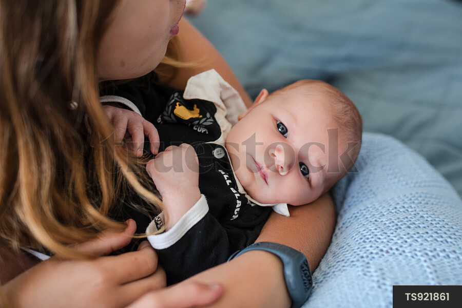 Girl holding baby sister
